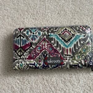 Like new Sakroots multi-colored zipper wallet.